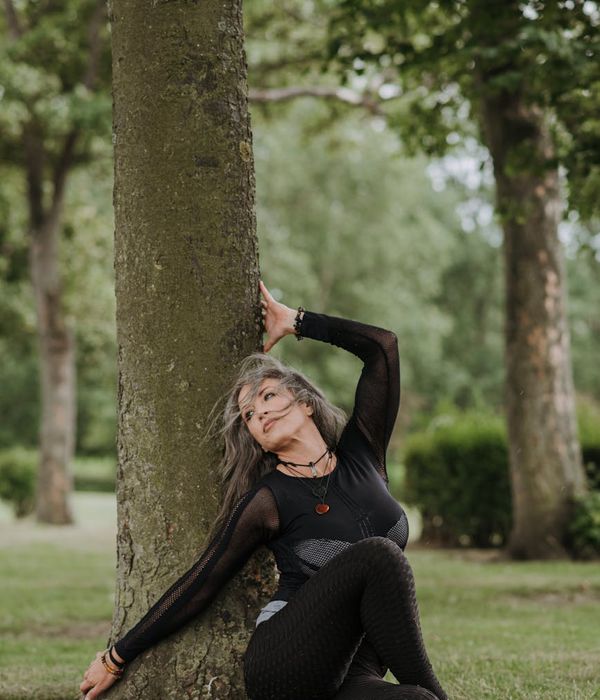 A woman in a calm, seated yoga pose, embodying balance and grace.